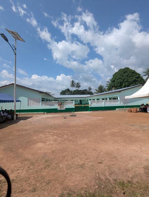 The newly built classroom blocks at Fodome Abledze, painted in green and white.